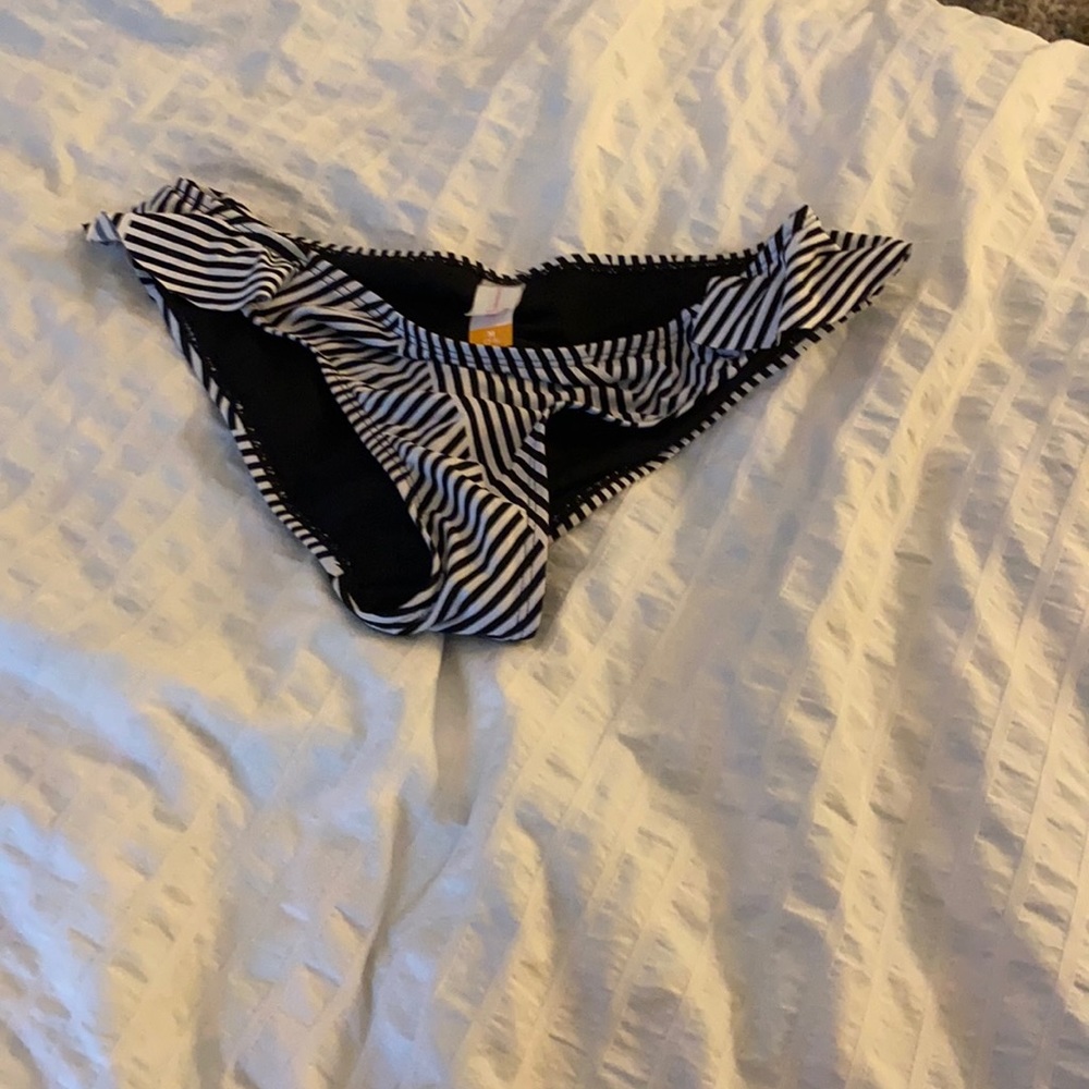 Striped swim bottoms with ruffles on side